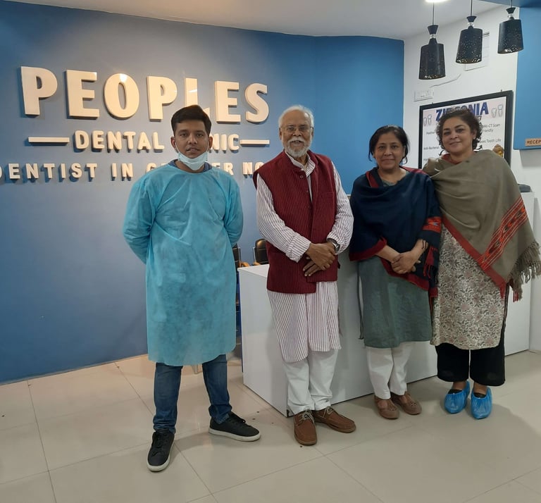 Peoples Dental Clinic - Dr. Ishan Singh with happy dental patients