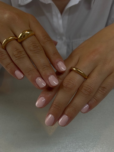 a woman's hands with two rings on them