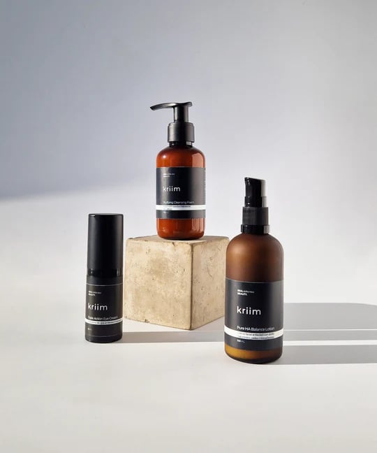 a variety of skin care products including a bottle of skin care products