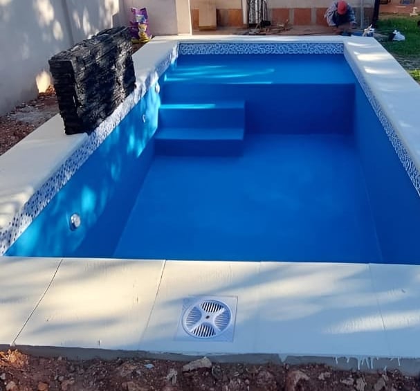 a pool with a water tank and a water tank