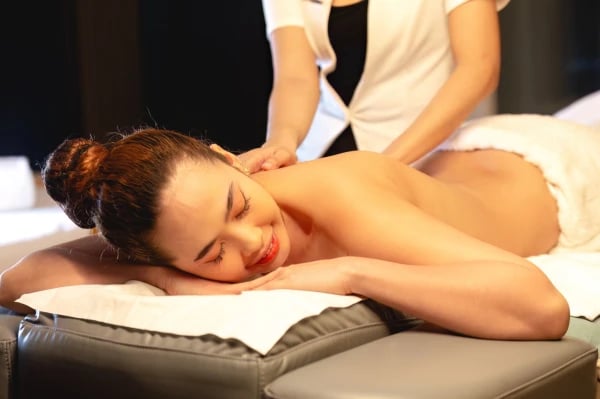 a woman getting a massage at a spa