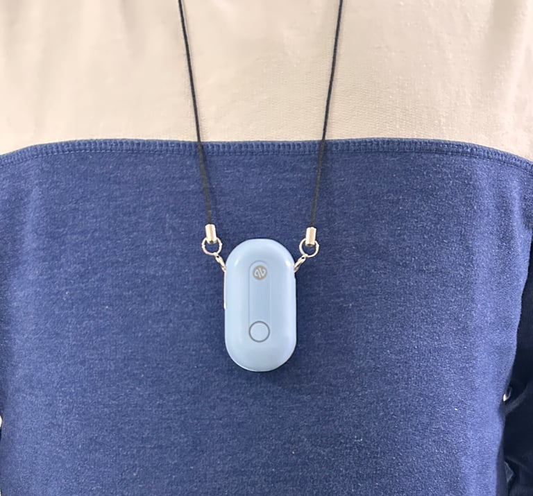 Person wearing Atovio air purifier