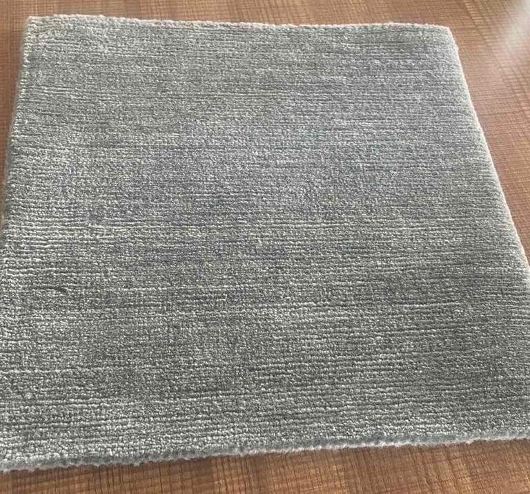 Hand-knotted rug sample crafted with Tibetan wool, showcasing premium quality and fine detailing