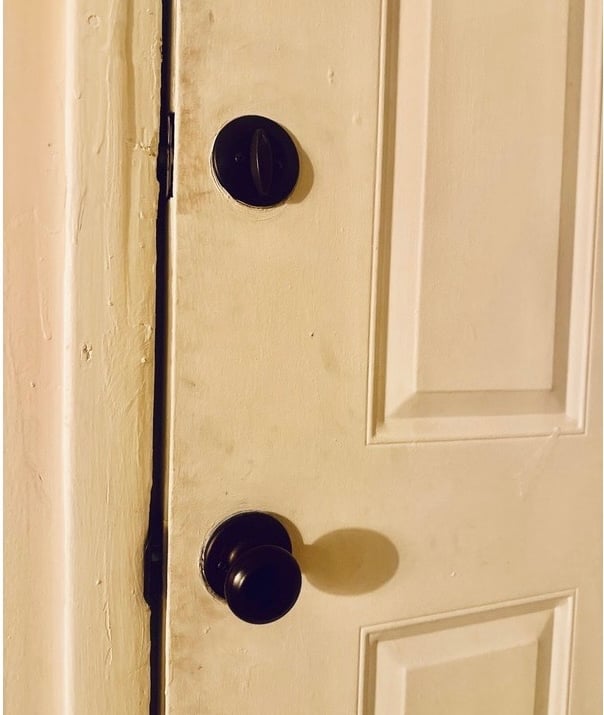 White door with deadbolt representing residential locksmith services including rekeying, key copy, and smart locks