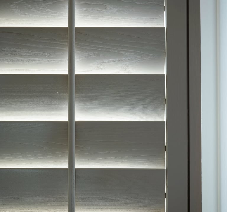 White wooden plantation shutters with hidden tilt rod