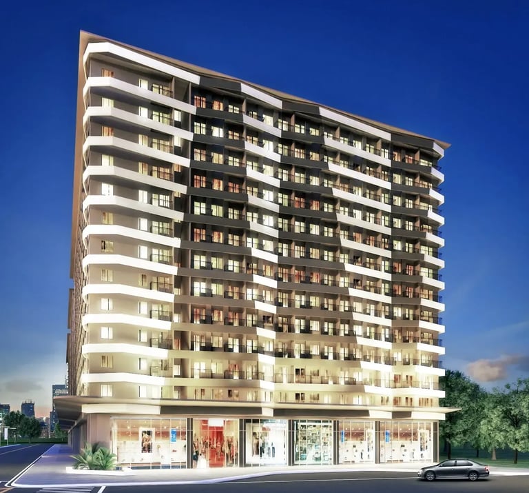 a tall building with a lot of windows and a car parked in front of it