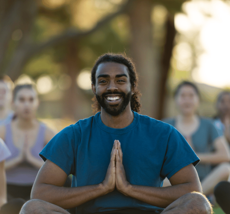 Handsome young man with namaste hands