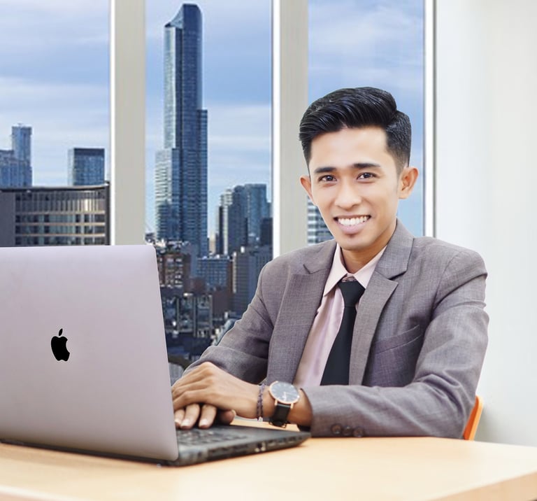 a man in a suit and tie is smiling and holding a laptop