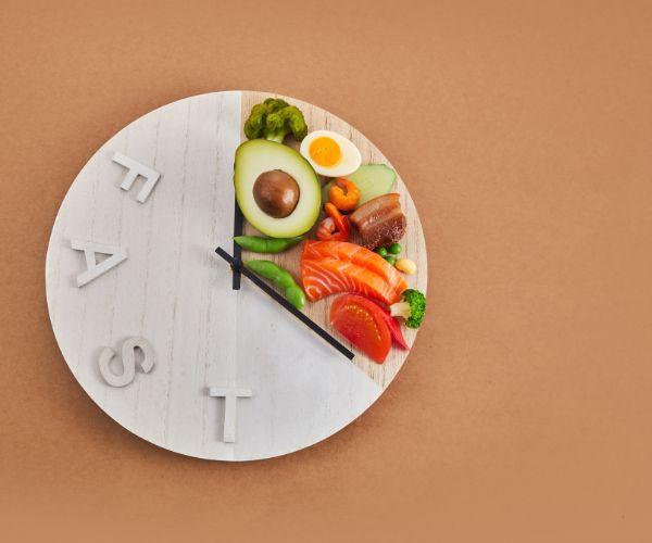 a clock on a plate with a clock on it