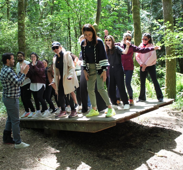 corporate team participating in a coordination and problem solving game outdoors
