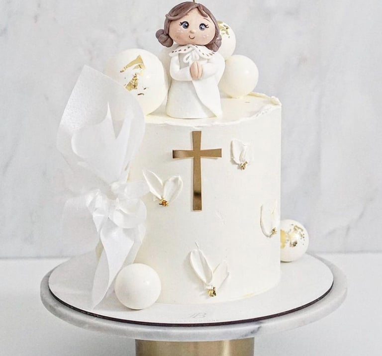 a cake with a little angel on top of it