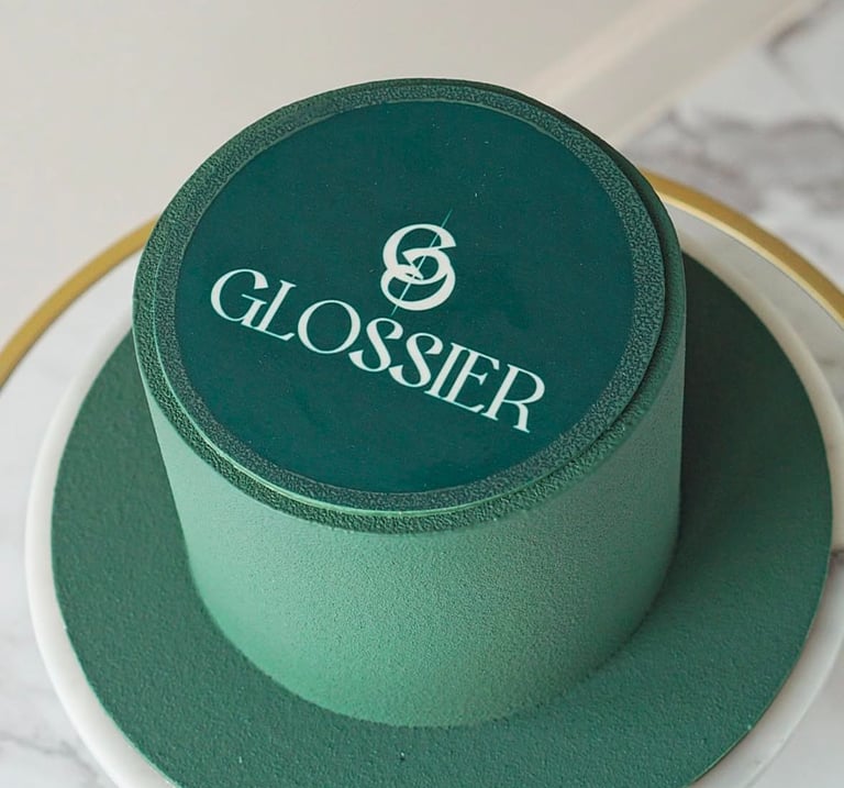 a cake with a green hat on top of a table