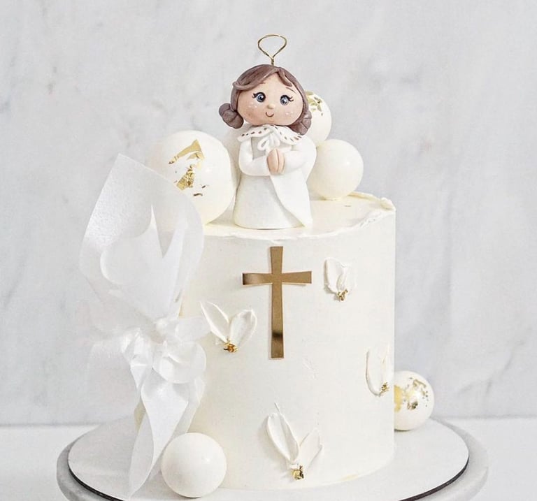 a cake with a little angel on top of it