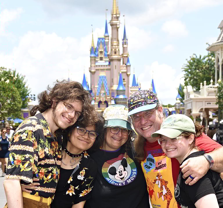 April Mazzola and her family in front of Cinderella's Castle at Disney World