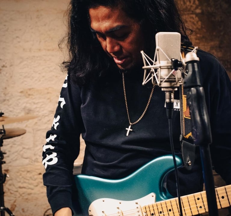 Gomer and a guitar in a recording studio