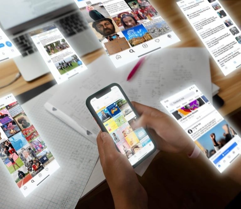 image of a person holding a phone looking at social media