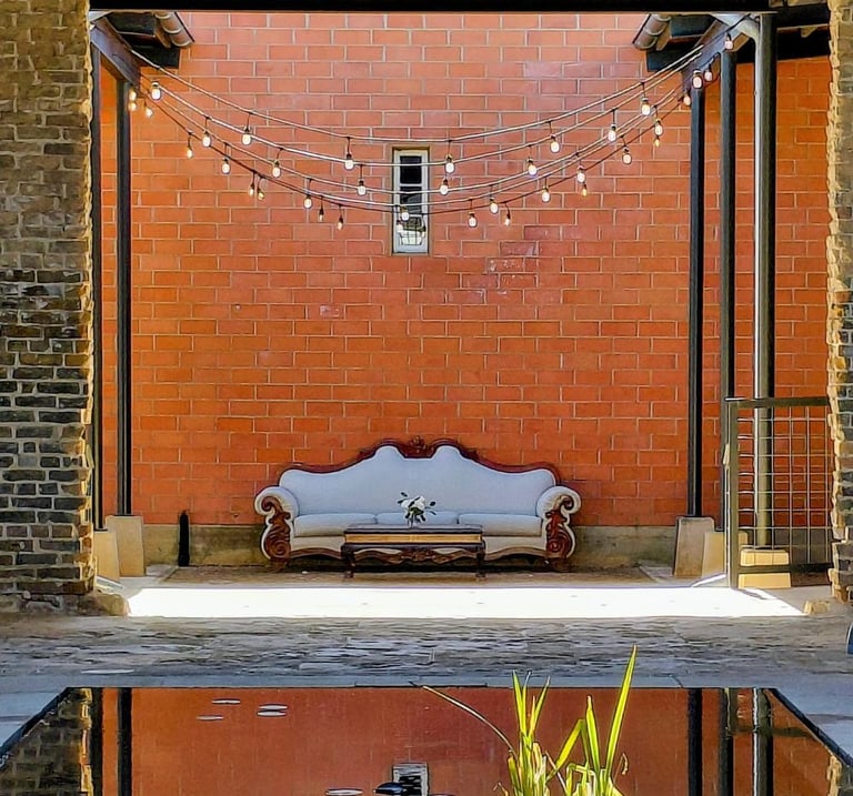 Calm pond with couch visible in the background