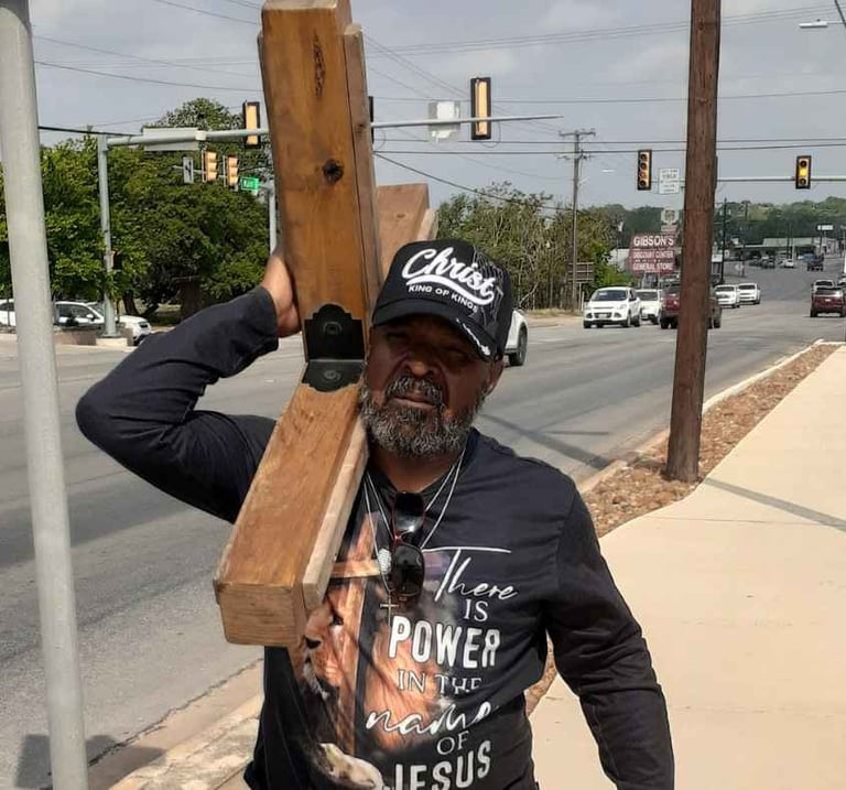 Christian brother Roderick Fifer carrying the Cross