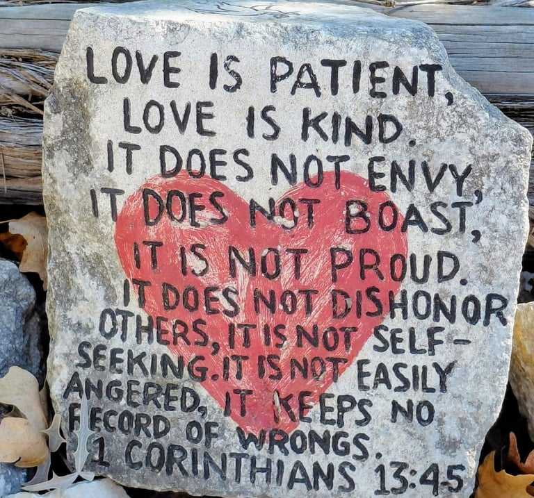 Rock with red heart in center and scripture verse
