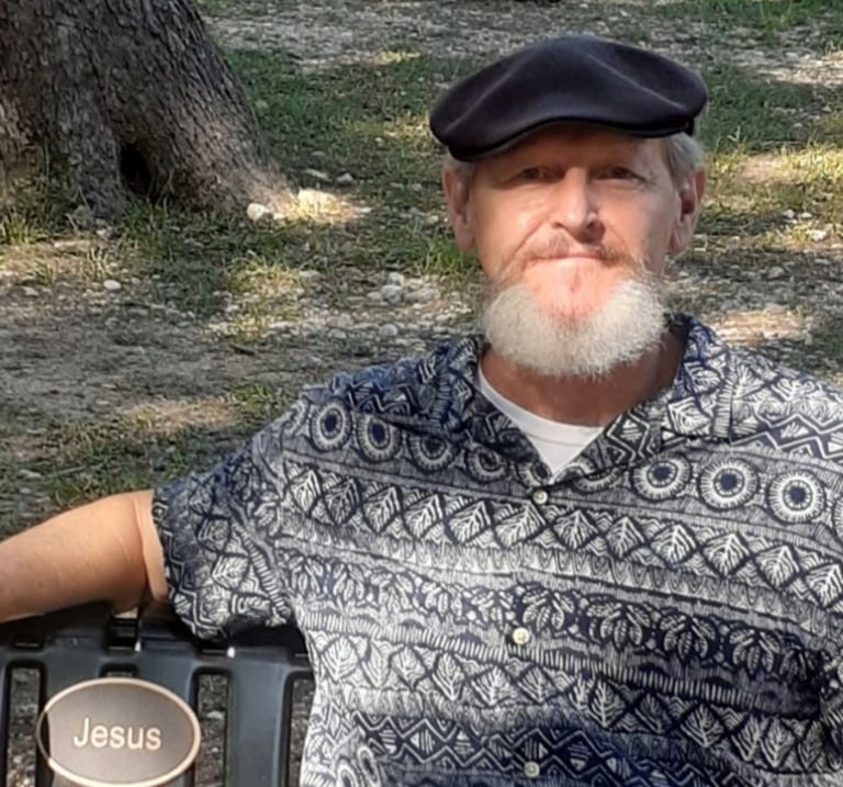 Christian brother Trace Pirtle sitting at Jesus Bench, Louise Hays Park