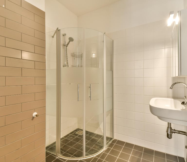 Shower water leak causing bathroom floor damage