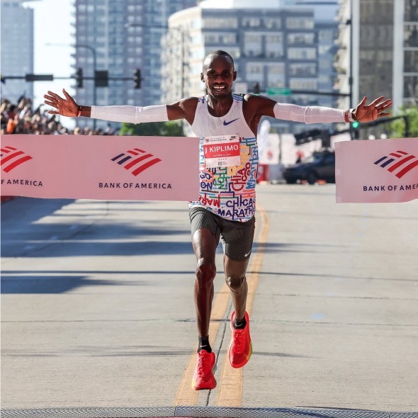 Jacob Kiplimo of Uganda raising his arms as he wins the 2025 Chicago Marathon in 2:02:23, the second-fastest time in course h