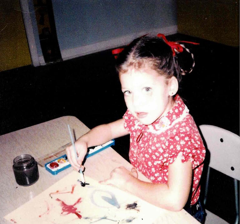 Young Paige Harlow painting