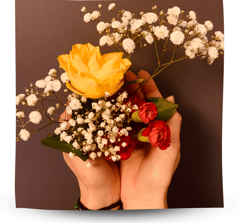 Martina holding flowers in her hands.