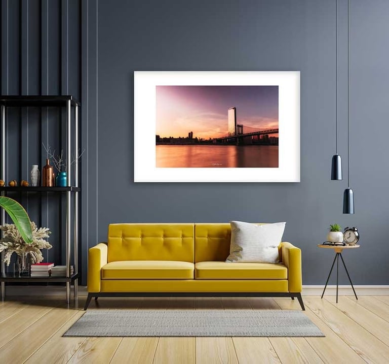 a couch in a living room with a picture frame