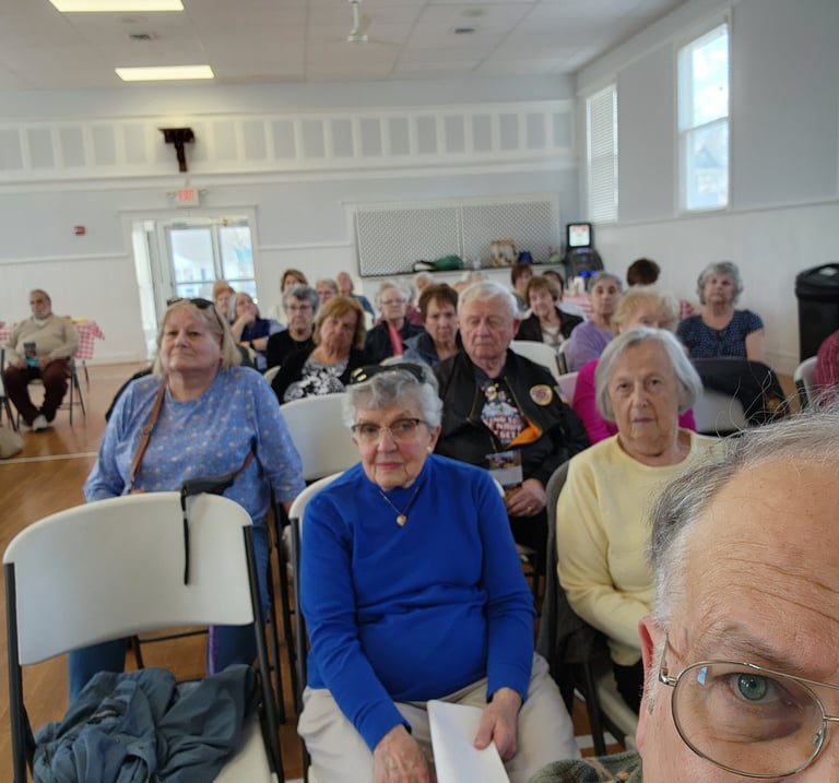 A picture of some members in a meeting.