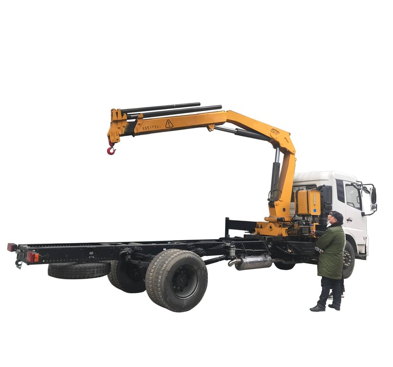 A man stands beside a robust crane with a 6.3 Ton Knuckle Boom. The crane's hexagon and pentagon boom design ensures stabilit