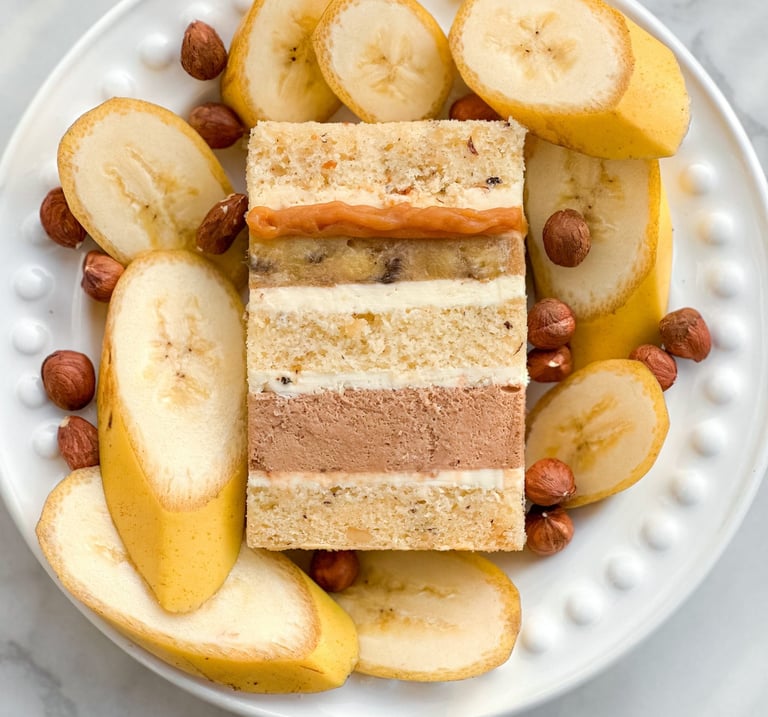 a plate with a slice of cake and nuts