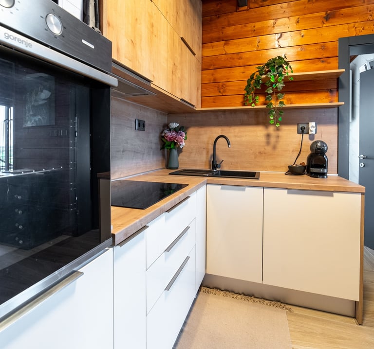 a kitchen with a stove top oven and a microwave
