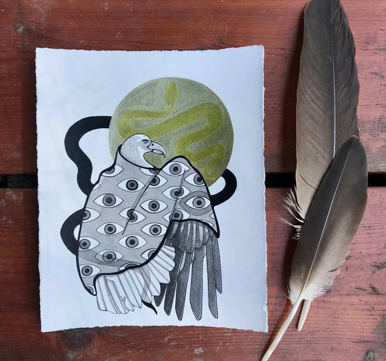 An eagle wearing a power blanket sitting in front of the moon. Two feathers frame the right side.
