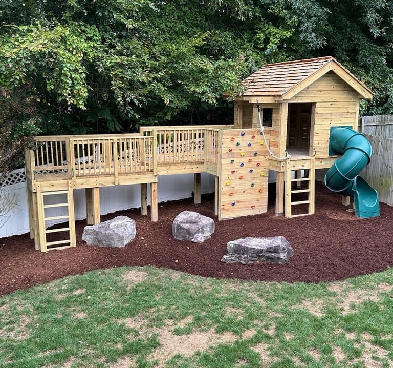 custom playhouse and play area created by The King's Garden