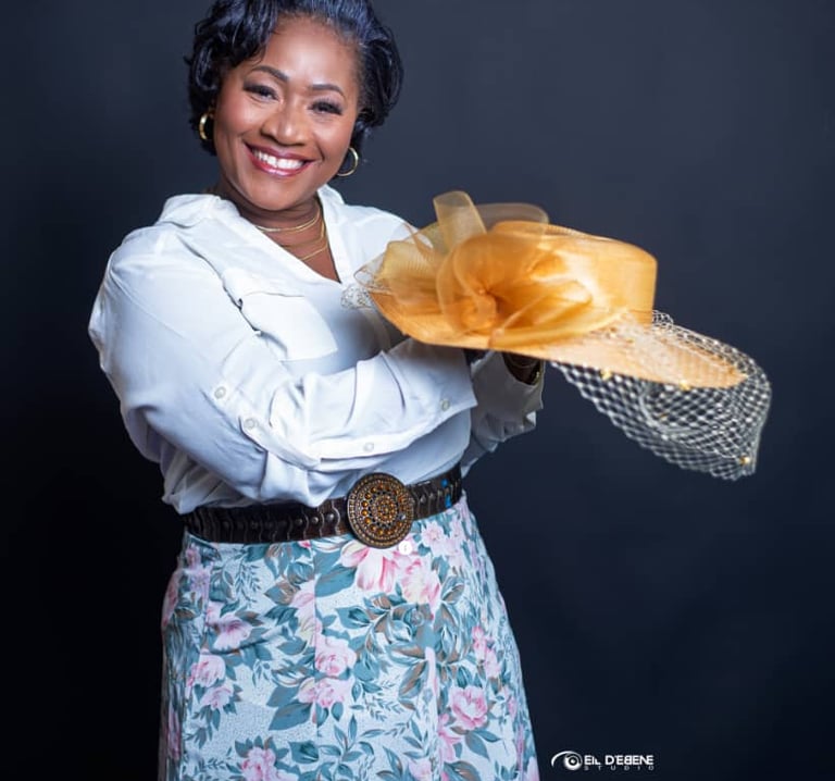 a woman in a white shirt and a hat