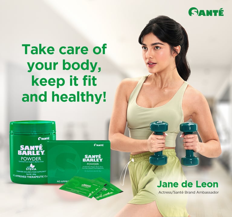 a woman in a green tank top and a pair of dumbs