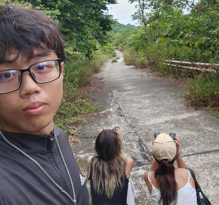 Da Nang tour guide and tourists watching langurs on Son Tra mountain.