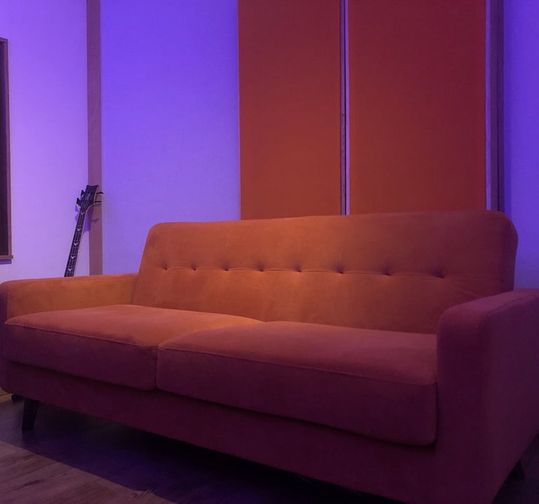 Orange sofa in Vox Music Recording Studio in Manchester