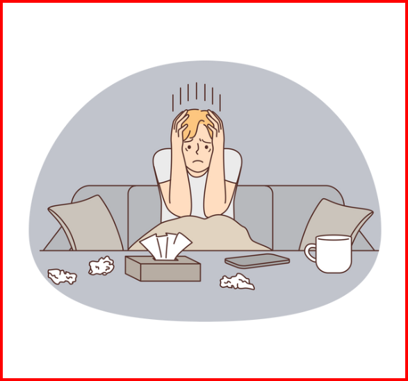 a sad man sitting on a couch with a laptop and papers