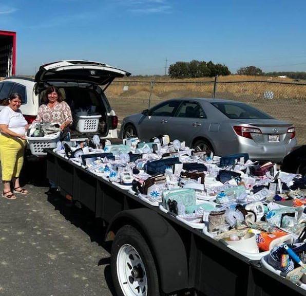 Picture of trailer full of bathroom kits for tiny homes at 4th & Hope