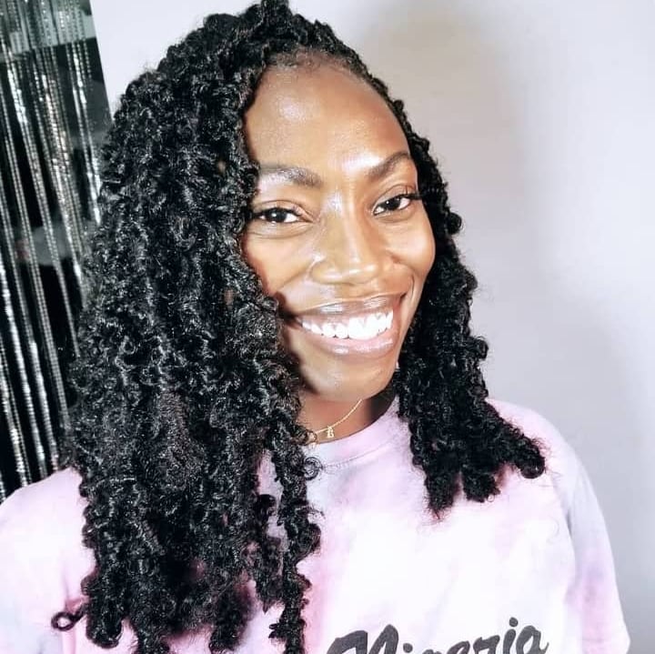 a woman with big black butterfly locs hairstyle