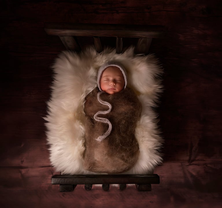 a baby in a blanket wrapped in a blanket
