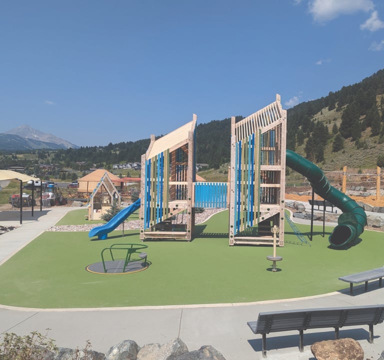 a playground with a slider and a slider