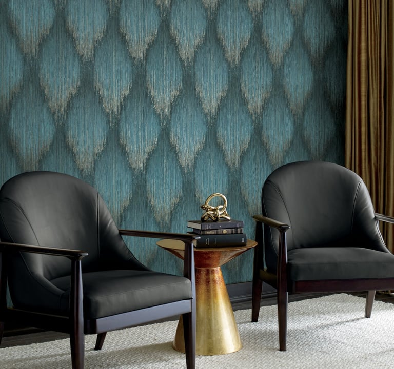 Modern living room featuring blue ikat textured wallpaper and two black leather armchairs.