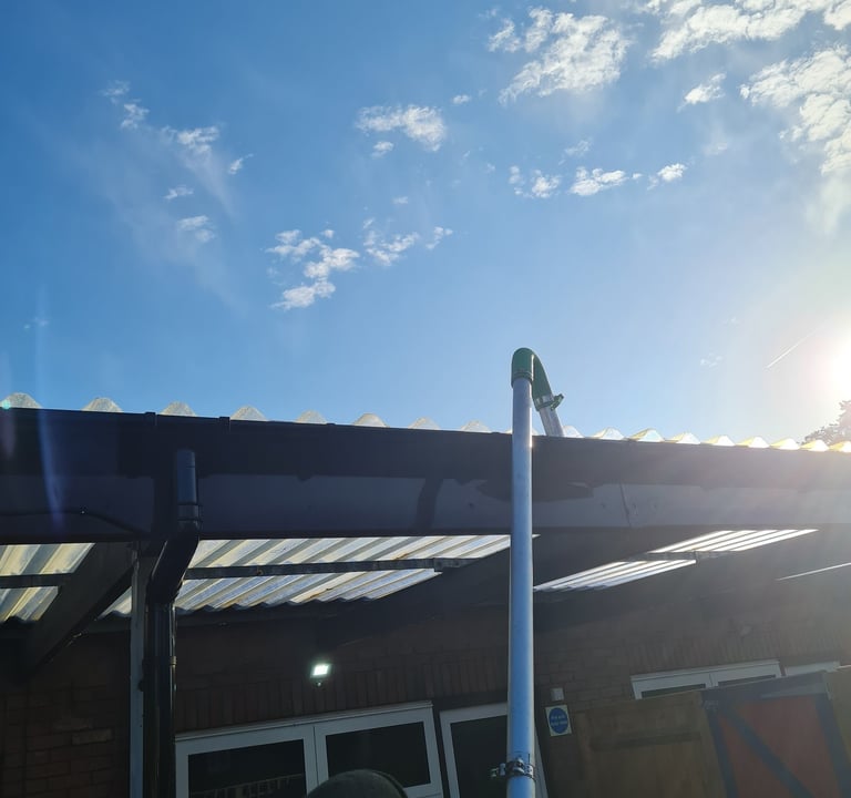 Gutter cleaning with pole and vac