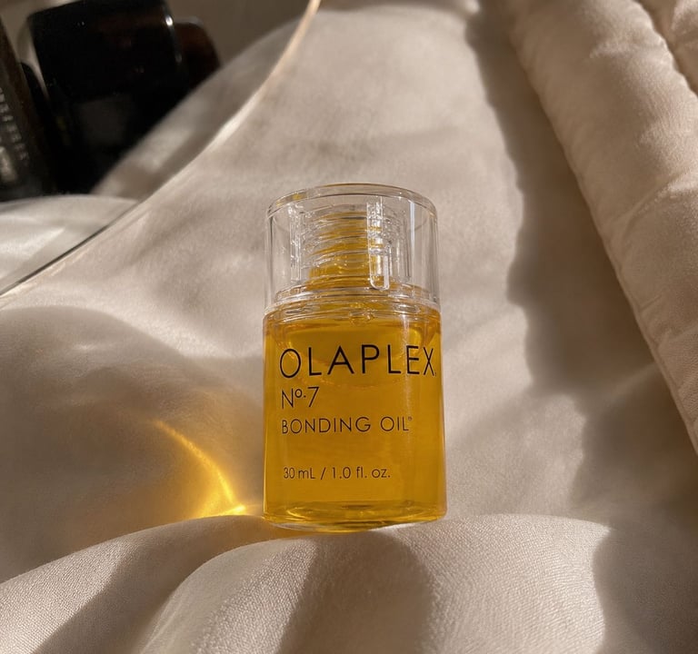 Olaplex No.7 Bonding Oil bottle with luxury neutral aesthetic