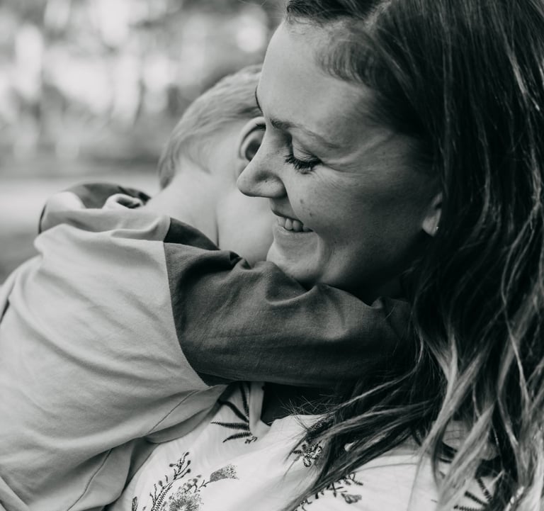 a woman holding a child in her arms