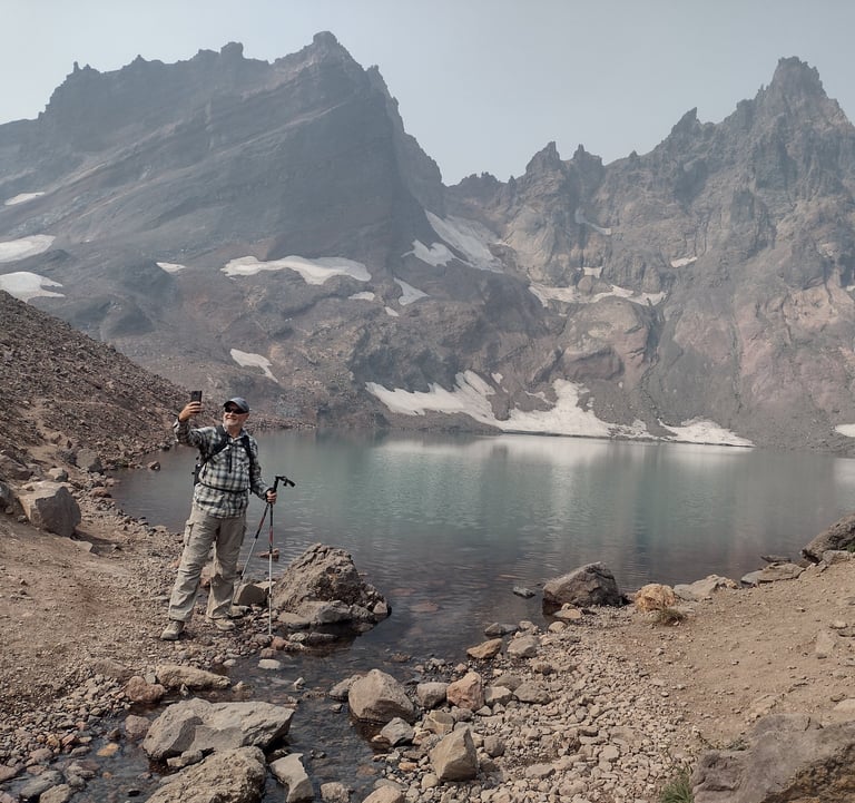 a man standing on a rocky mountain top