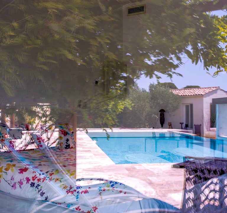 Bedroom with king size bed, swimming pool view being seen from outside at Domaine Des Lucques